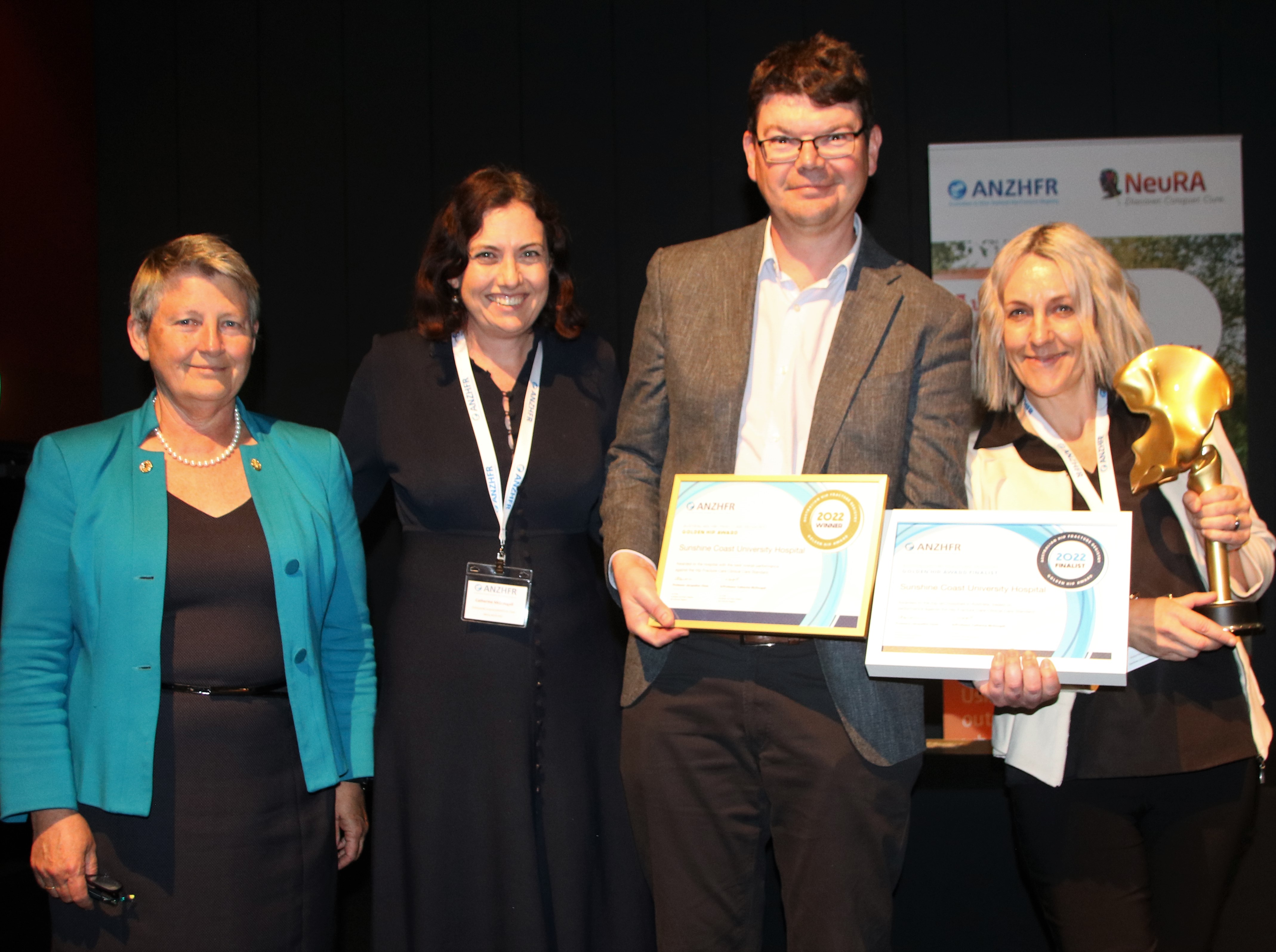 Sunshine Coast University Hospital accepts Golden Hip award for Best Performing Hospital, Australia. 
Pictured: Dr Annette Holian (President, AOA), A/Professor Catherine McDougall (Co-Chair, ANZHFR), Dr Stephen Murray (Geriatrician, SCUH) and Ms Nicol Lightbody (Clinical Nurse Consultant, Orthopaedics, SCUH)